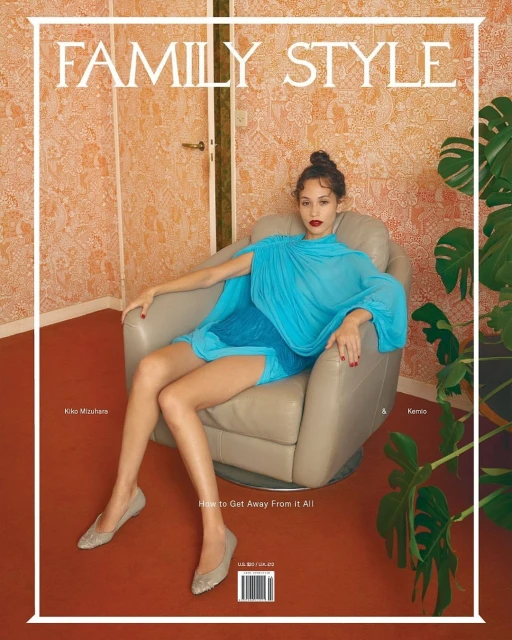 Magazine cover shot: Woman in blue dress sits in tan chair, with floral wallpaper and green plant visible. Text reads 'Family Style'.