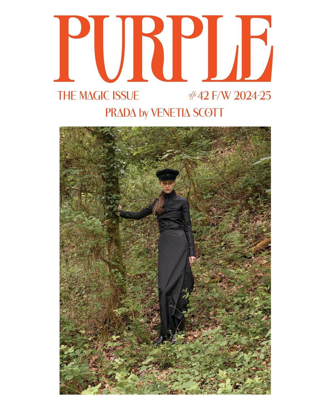 Purple Magazine cover featuring a model in black dress and hat posing in a forest setting with vibrant orange magazine title.