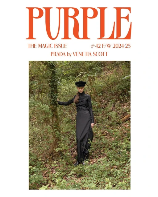 Purple Magazine cover featuring a model in black dress and hat posing in a forest setting with vibrant orange magazine title.