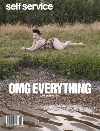 Magazine cover featuring a woman in a leopard print swimsuit lying on grass near a body of water, with the title 'self service'.