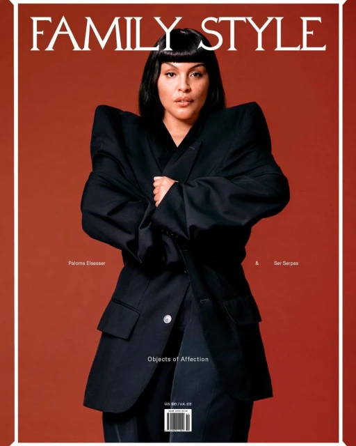 Magazine cover featuring a woman with black hair wearing a black blazer against a red background, promoting 'Family Style'.