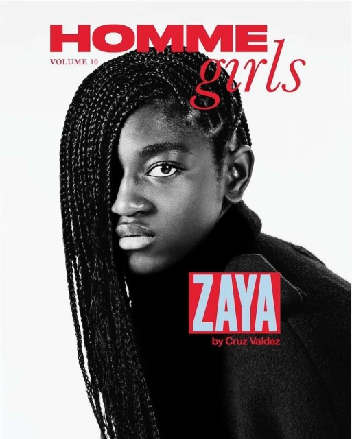 Magazine cover featuring a Black young adult with braided hair, wearing a dark turtleneck, set against a bright, clean backdrop.