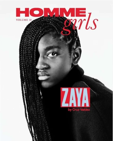 Magazine cover featuring a Black young adult with braided hair, wearing a dark turtleneck, set against a bright, clean backdrop.