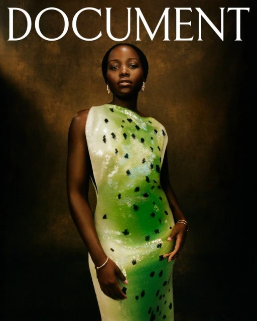 Magazine cover featuring Lupita Nyong'o in a green dress with black polka dots, posing against a brown background.