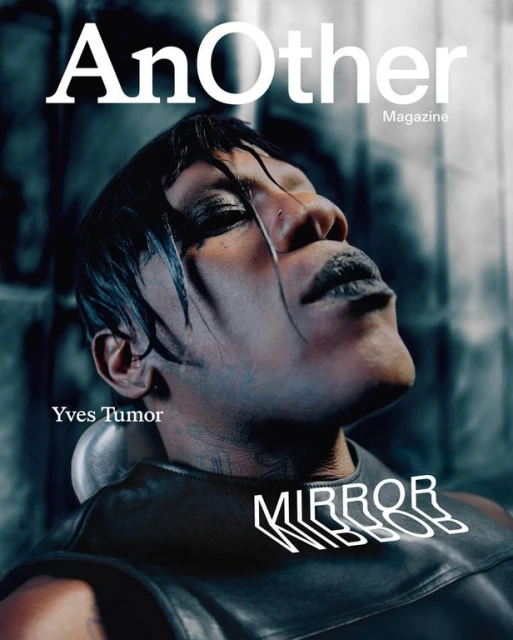 Magazine cover featuring Yves Tumor with a wet hair look and dark makeup against a textured background, with prominent magazine text.