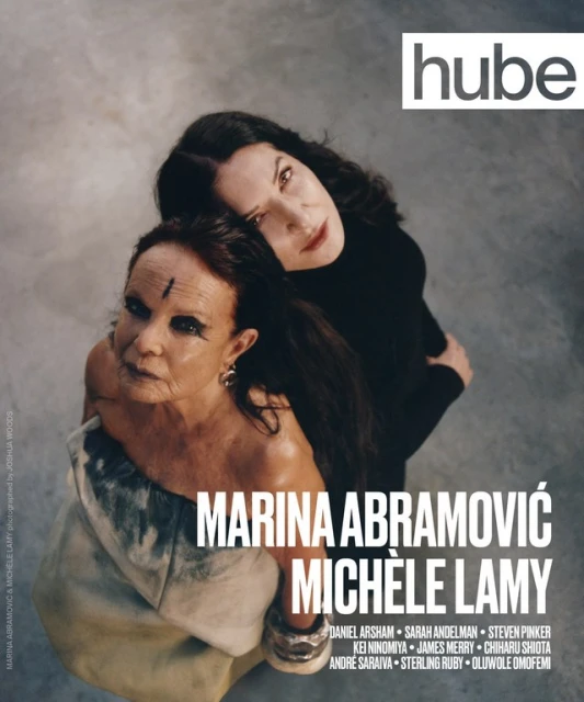 High-angle portrait of two women, Marina Abramović and Michèle Lamy, posing for hube magazine, showcasing artistic fashion and makeup.