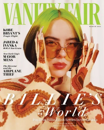 Vanity Fair magazine cover March 2021 featuring Billie Eilish, wearing patterned jacket and glasses, hands framing her face.