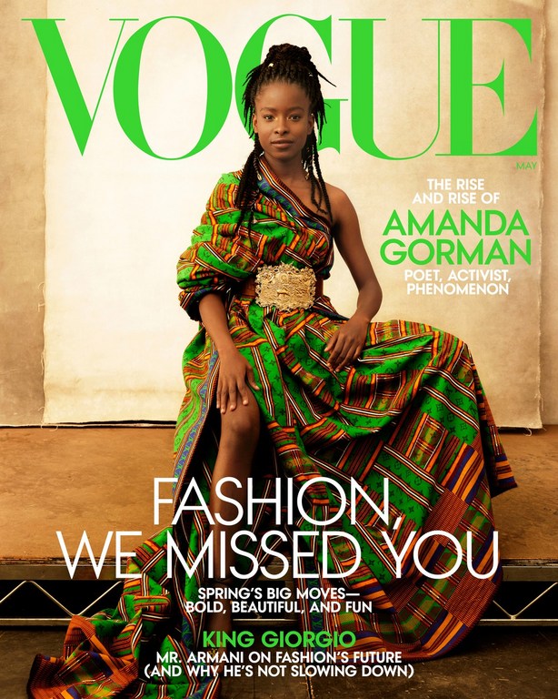 Vogue magazine cover featuring Amanda Gorman in a patterned dress with a gold belt, posing against a neutral background with text overlay.