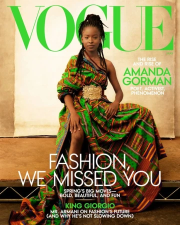 Vogue magazine cover featuring Amanda Gorman in a patterned dress with a gold belt, posing against a neutral background with text overlay.