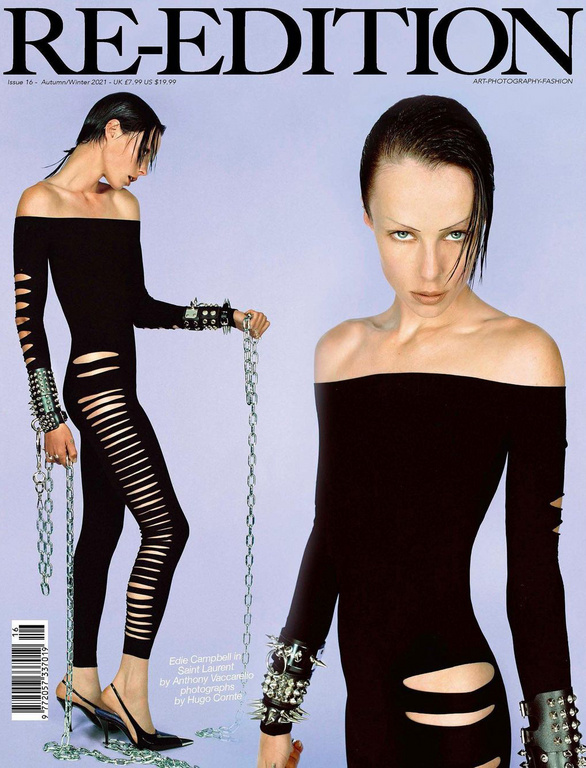 Magazine cover featuring model Edie Campbell in an off-the-shoulder black catsuit with cutouts, metal bracelets, and chains on a light blue backdrop.