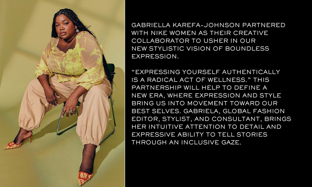 A plus-size African American woman sits on a chair wearing a yellow and beige top with beige pants and patterned heels in a studio.
