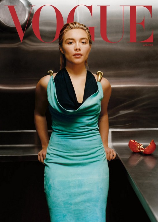Florence Pugh in a teal dress with black halter top styled by Gabriella Karefa-Johnson against a metal wall