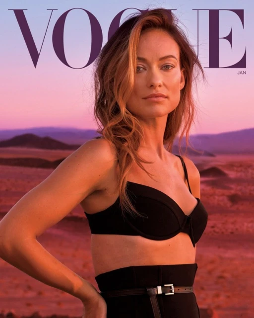 Portrait of Olivia Wilde on a Vogue cover, showcasing black attire and desert background with a pink and purple sky at dusk.