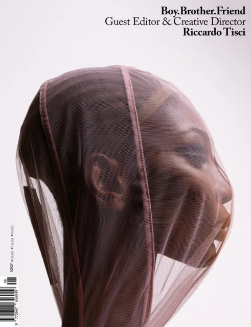 Magazine cover featuring a woman with a sheer veil over her head, with text "Boy.Brother.Friend Guest Editor & Creative Director Riccardo Tisci".