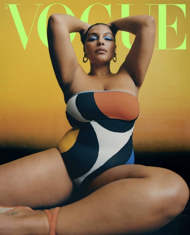 Vogue cover featuring a plus-size adult female with blue eyeshadow and hoop earrings in a patterned swimsuit, hands behind head.