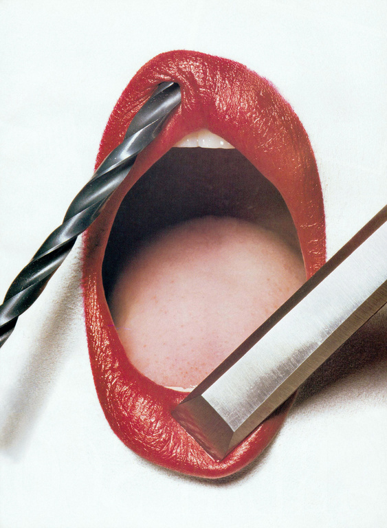 Red lips with a drill bit inserted and a chisel placed alongside, artistic composition on a white backdrop.