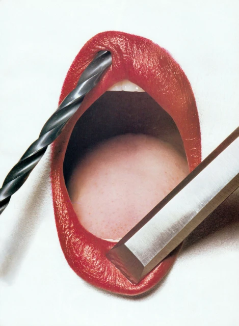 Red lips with a drill bit inserted and a chisel placed alongside, artistic composition on a white backdrop.