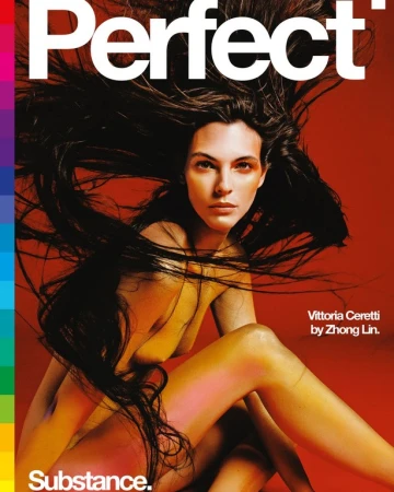 Elegant portrait of a nude fair-skinned adult female with long brown hair against a bold red backdrop for a magazine cover.