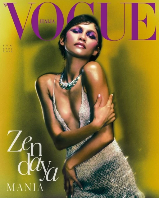Vogue Italia cover featuring Zendaya wearing a sparkling dress and necklace, posing against a blurred yellow background.