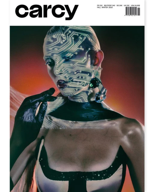 Magazine cover featuring a woman with a circuit board pattern projected onto her face, wearing jewelry and a black-and-white top.