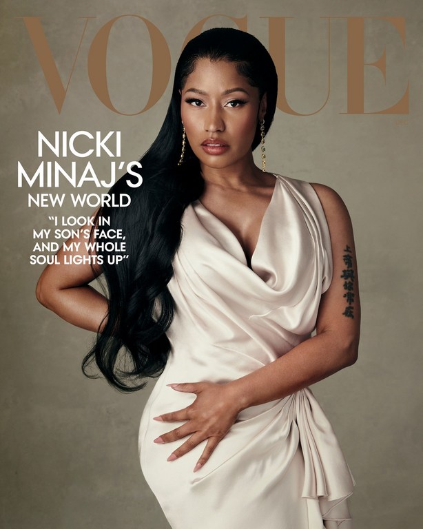 Nicki Minaj Vogue cover. Woman with dark hair poses in champagne-colored satin dress, looking at camera. Magazine cover with article quote.