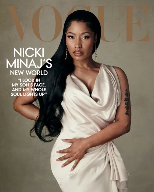 Nicki Minaj Vogue cover. Woman with dark hair poses in champagne-colored satin dress, looking at camera. Magazine cover with article quote.