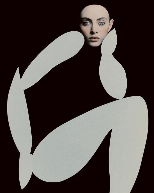 Surreal portrait of a woman with a bald head and pale skin, posing with light grey abstract shapes against a solid black background.