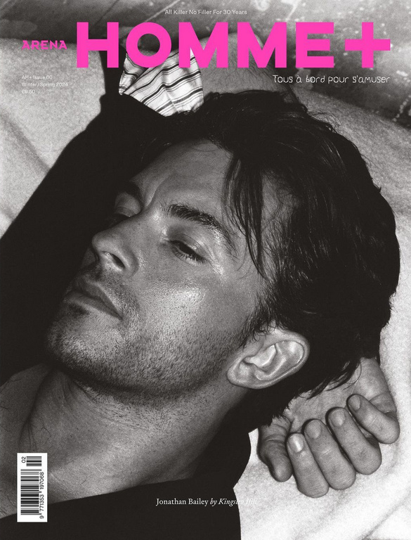 Black and white close up portrait of Jonathan Bailey reclining with hand near his head for Arena Homme Plus magazine