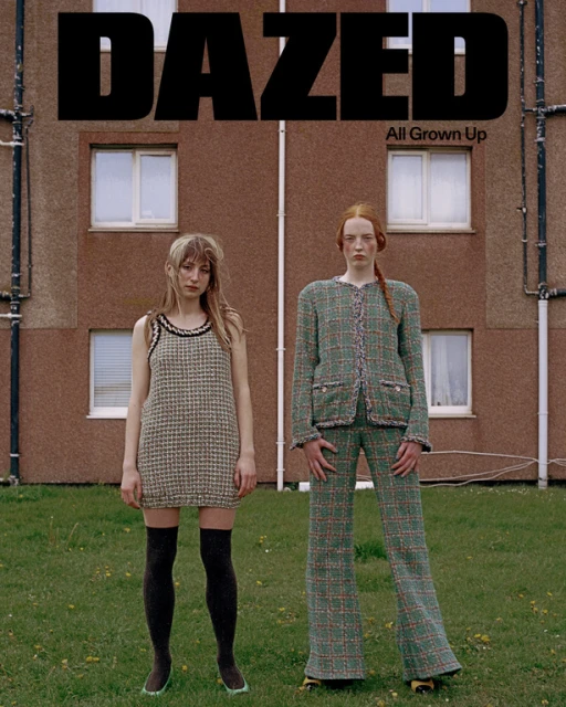 Dazed magazine cover featuring two young women in vintage-style outfits standing in front of a brown building with a lawn.