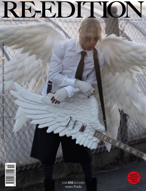 Magazine cover features a person with blond hair, wings, and a wing-shaped guitar wearing a white shirt and tie, and black shorts against a fence.