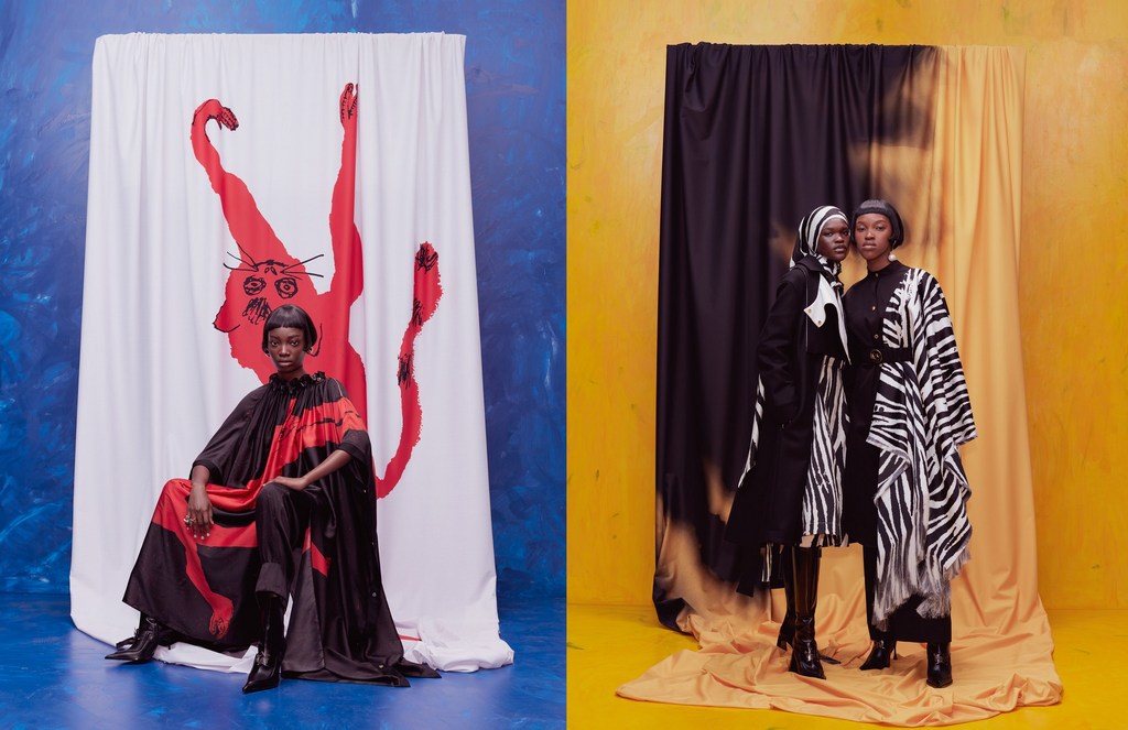 Two women showcase black-and-white patterned outfits against studio backdrops; one seated by a red cat drawing, the other standing.