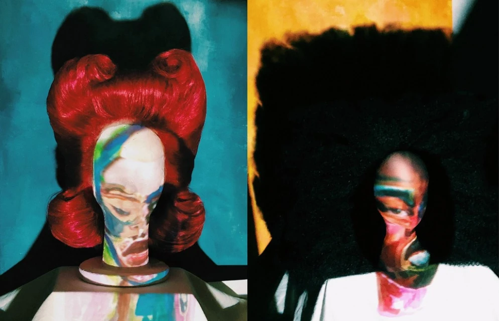 Stylized mannequin heads with vibrant hair and colorful abstract face paint, set against contrasting backgrounds in a studio environment.