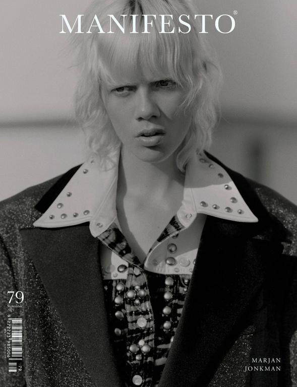 Black and white fashion magazine cover featuring a young adult female model with light blonde hair wearing a studded collar shirt.