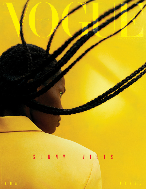Vogue Portugal magazine cover featuring a woman with braided hair in a yellow jacket against a yellow background. Fashion editorial shot.