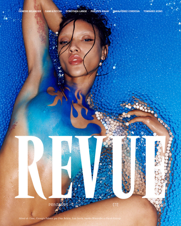 Magazine cover featuring a woman with blue body paint and pearl jewelry against a blue beaded backdrop, advertising spring/summer fashion.