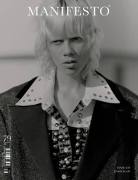 Monochrome fashion portrait of a model with blonde hair wearing a studded collared shirt and jacket for Manifesto