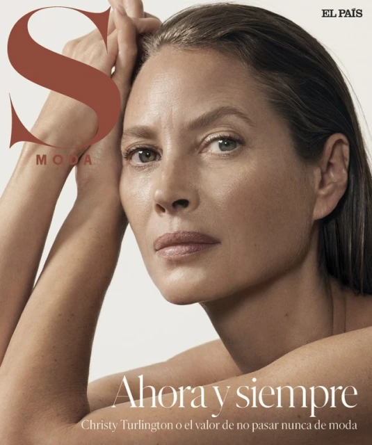 Close-up studio portrait of a mature woman with natural makeup and hands near her face, shot for a magazine cover with visible masthead.