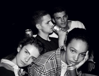 Black and white portrait of a group of four young models holding beverage cans, cast by AamO.