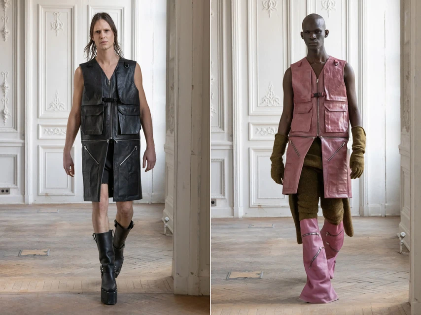 Two fashion models pose indoors wearing avant-garde leather vests and platform boots in a minimalist editorial fashion shoot.