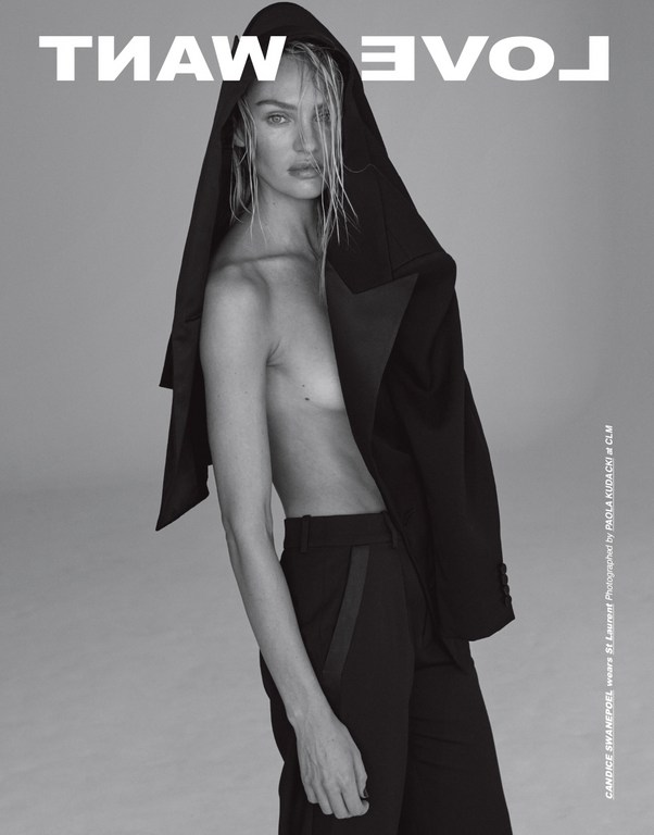 Black and white portrait of a woman wearing a suit jacket draped over her head, posing against a grey background with bold text.