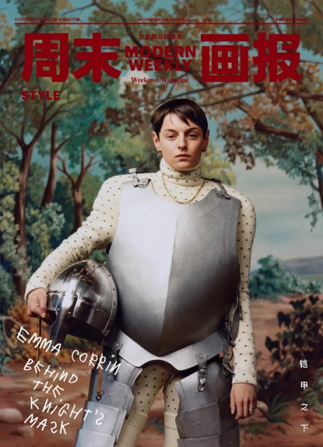 Emma Corrin on the cover of Modern Weekly, wearing knight's armor, holding a helmet, and posing against a painterly backdrop of trees.