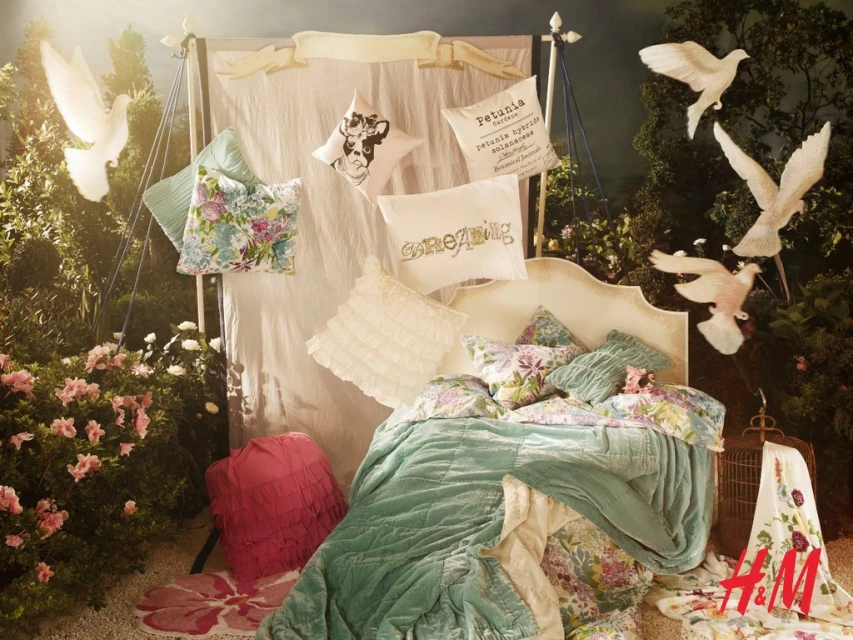 Dreamy indoor scene with bedding, pillows, doves, and floral arrangements, creating a whimsical and cozy ambiance.