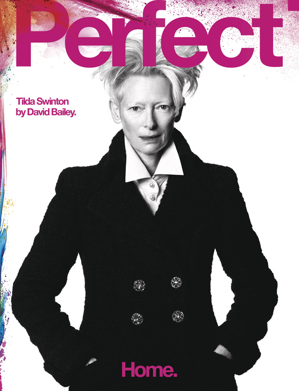 Tilda Swinton on the cover of Perfect Magazine, wearing a black coat against a white background with magazine text at the top.
