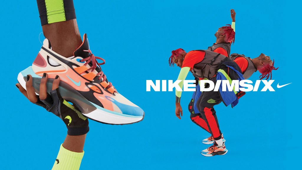Nike D/MS/X sneakers are prominently displayed. A man is striking a dynamic pose in bright apparel against a bold blue backdrop.