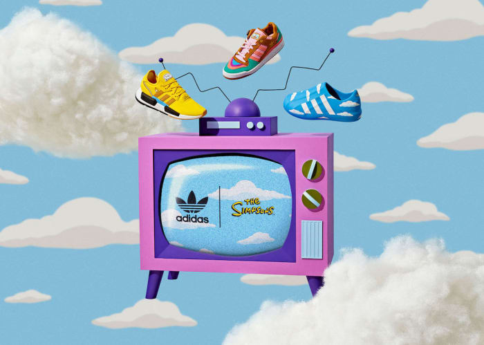 Three Adidas sneakers float above a pink television featuring Adidas and The Simpsons logos against a cloudy blue sky backdrop.