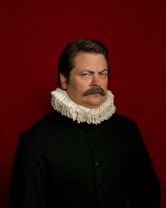 Portrait of a man with a mustache in a black coat and white ruff collar against a solid red background, looking at the camera.