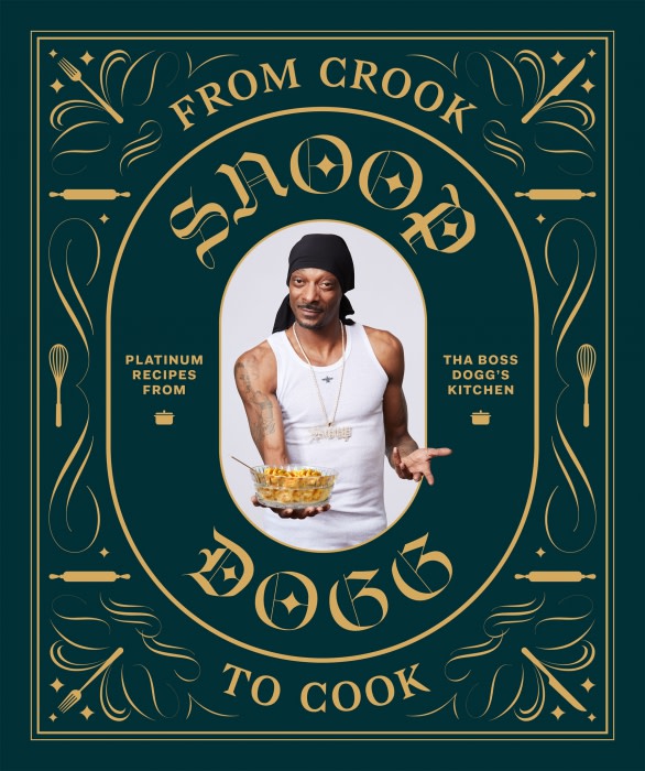 Snoop Dogg in promotional image for his cookbook “From Crook to Cook”, holding a dish of macaroni and cheese in an ornate frame.