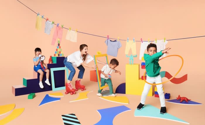 Playful scene featuring a woman, two kids, and a boy with a hula hoop, surrounded by colorful shapes and hanging clothes against a peach background.