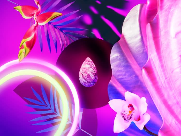 Floral arrangement with tropical flowers, orchids, palm leaves, and neon lights in vibrant pink and purple hues against a dark background.