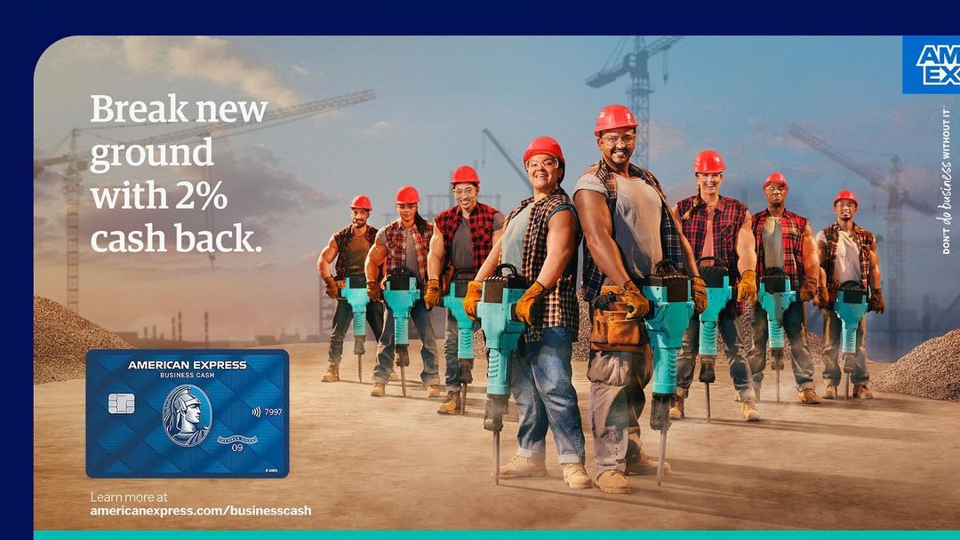 American Express ad featuring construction workers with jackhammers, promoting 2% cash back on business expenses, with a blue credit card.